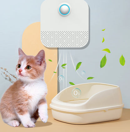 Rechargeable Litter Box Odor Eliminator next to a litter box